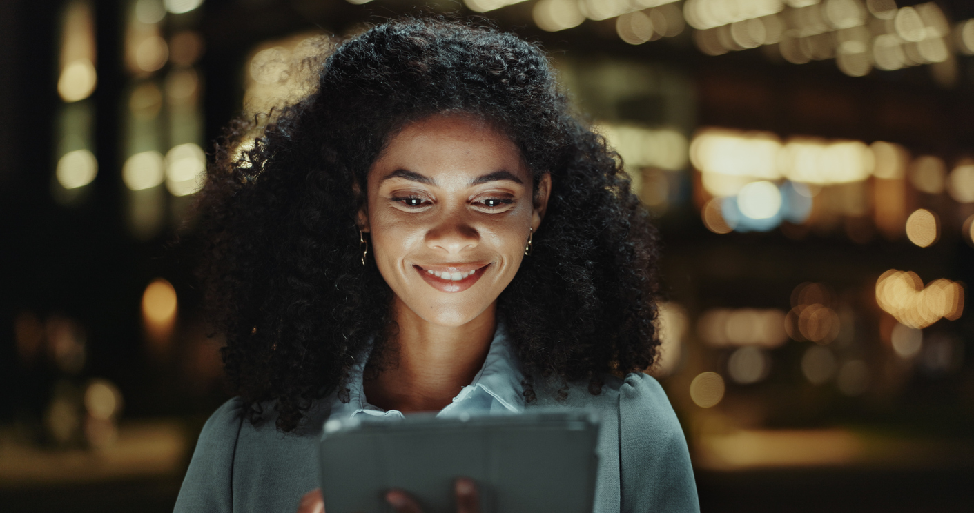 woman smiles because she has unified data for her multi location thrift retail store with Brijjworks